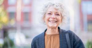 A woman is happy as she applies senior incontinence management tips.